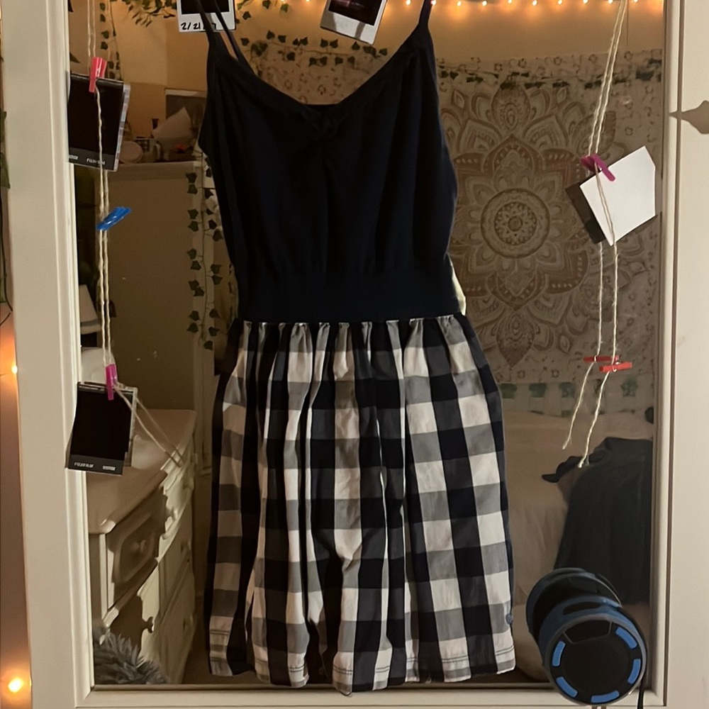Tight waisted short dress with plaid skirt and flattering upper half!
